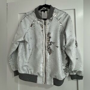 Jocelyn glitz jacket never been worn size small. Can be worn white or silver